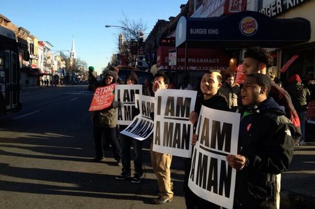 Workers rally outside a Burger King in Flatbush